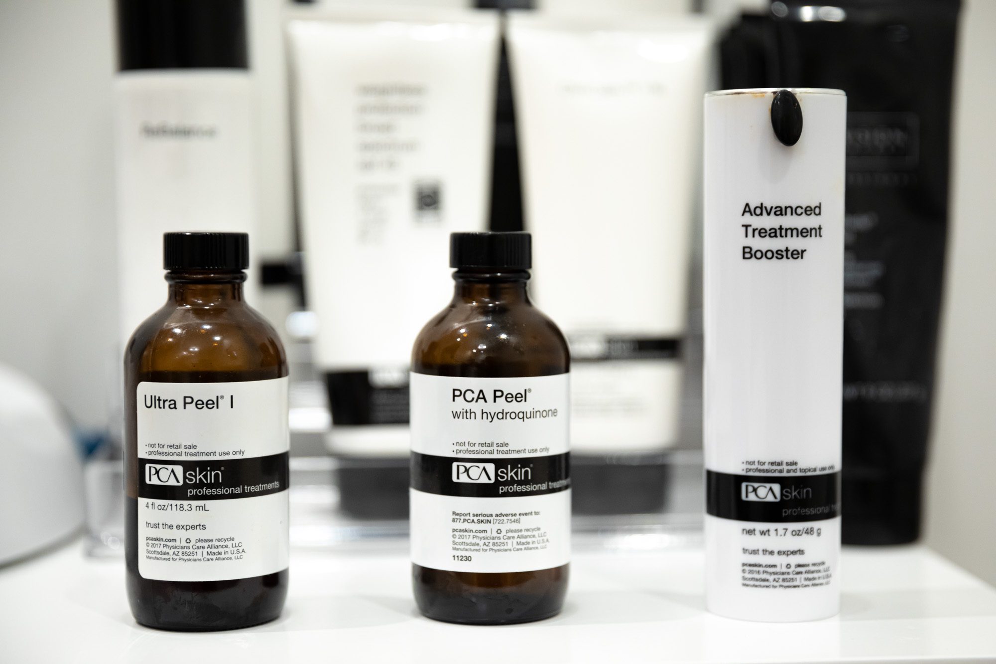 Skincare products displayed on white countertop