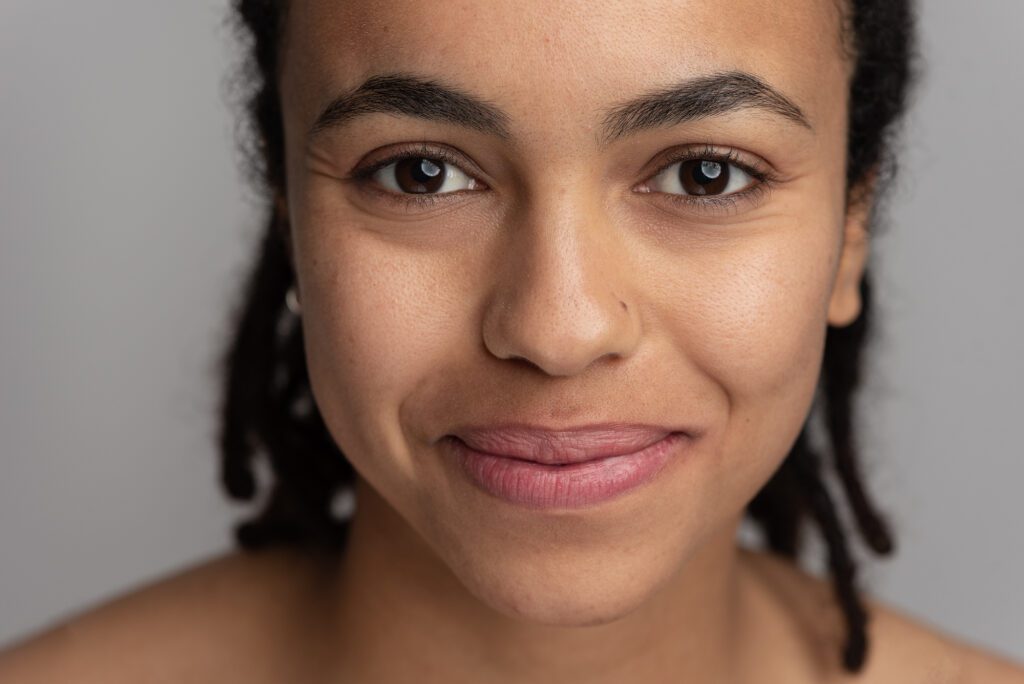 Smiling woman with glowing clear skin