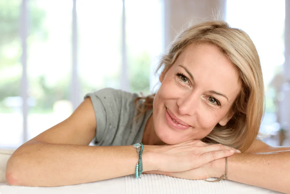 Woman smiling on a couch