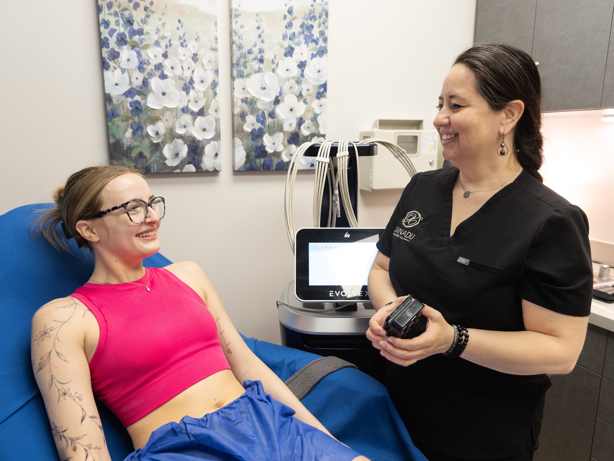Technician performing laser hair removal procedure