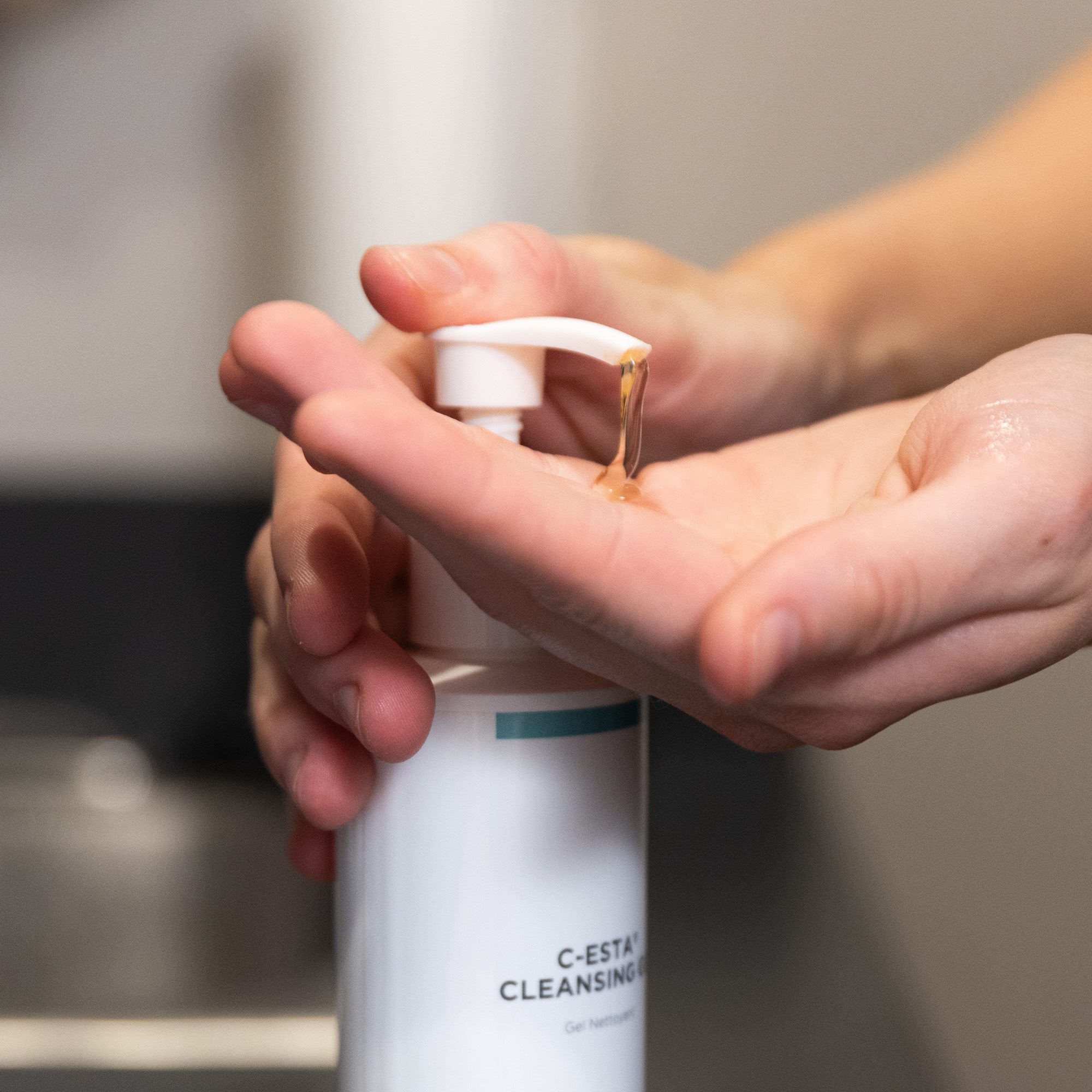 Dispensing C-ESTA cleansing gel into hand