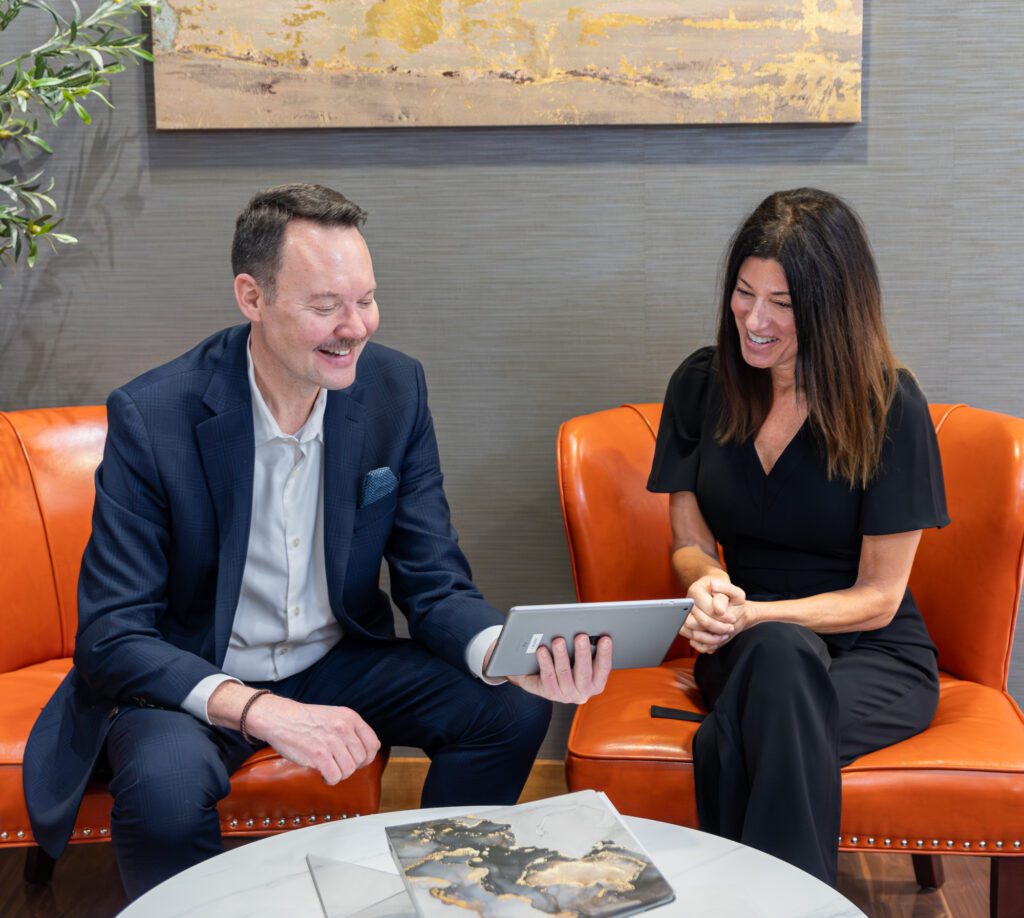 Professional consultation between client and expert reviewing treatment options.