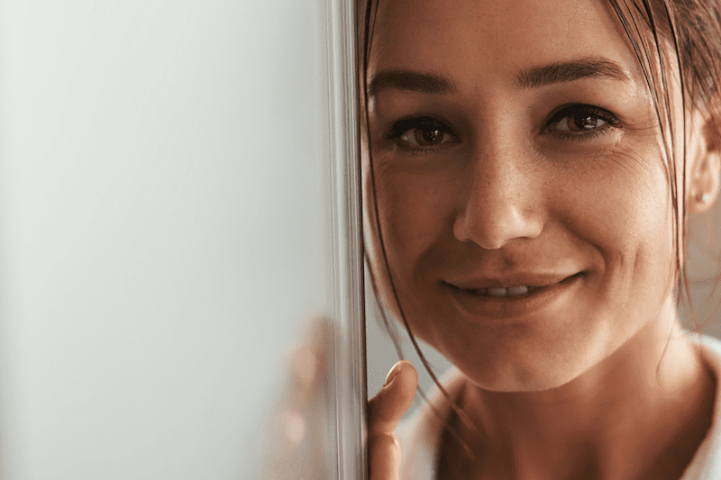 Smiling woman with clear, glowing skin
